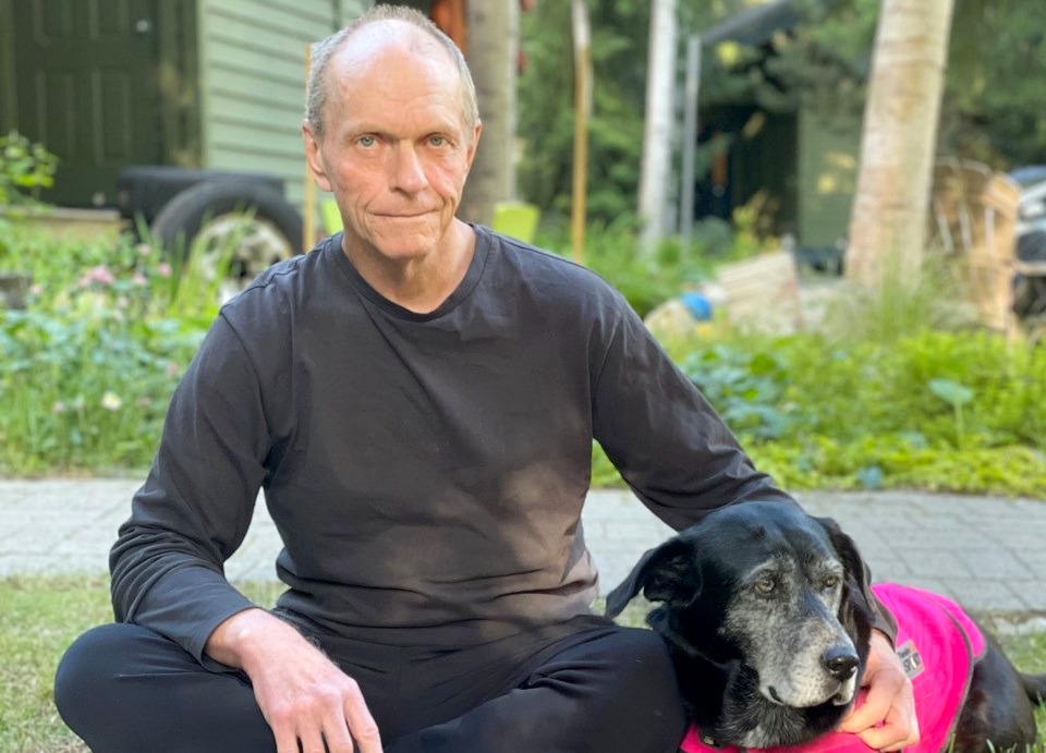 Michael Burnett with his dog in Whistler
